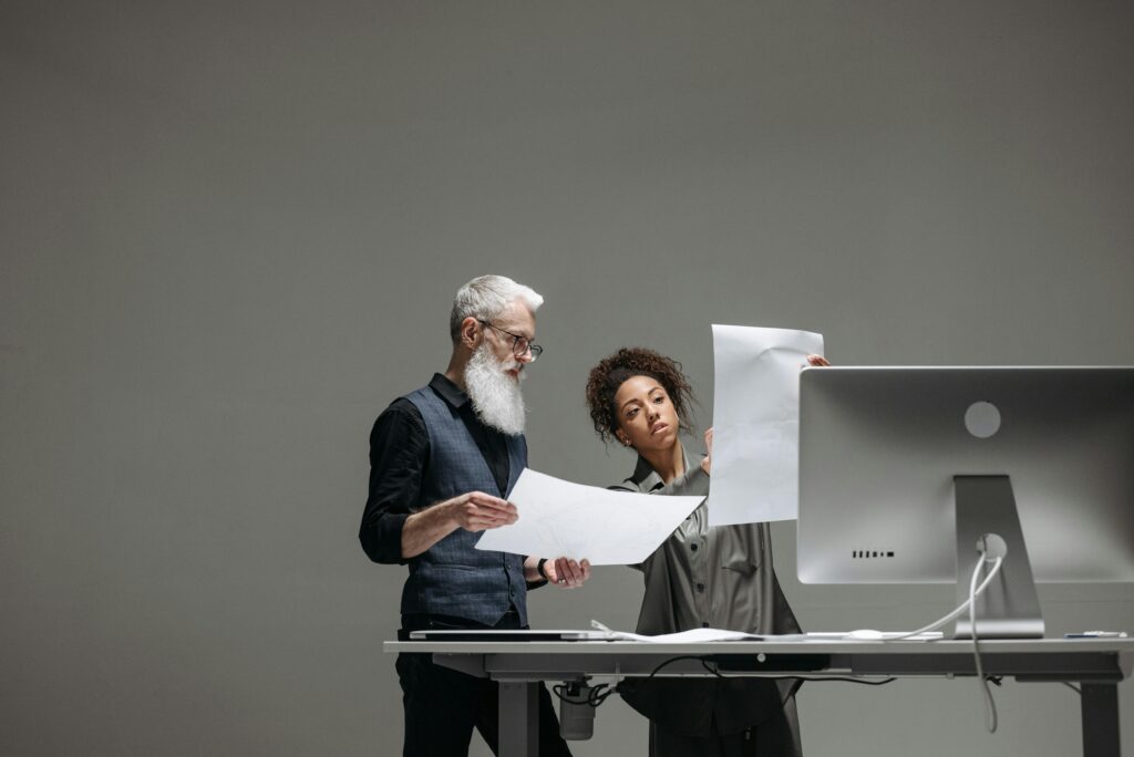 Business team analyzing AI pricing and performance dashboard for Claude vs ChatGPT vs Gemini vs Llama