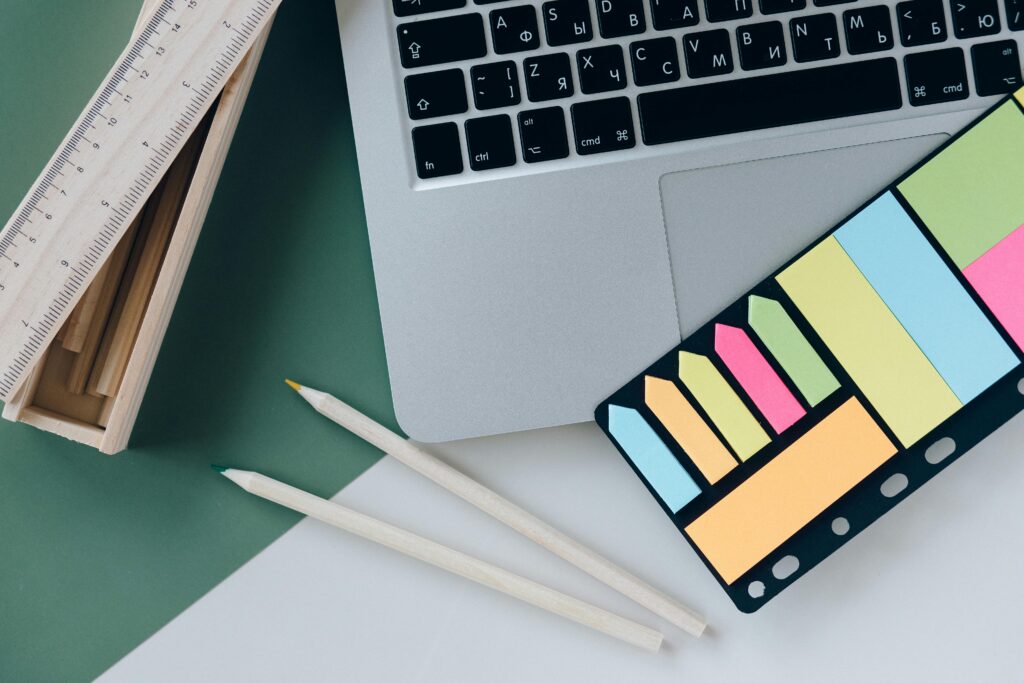 Minimal desk setup showing notes and planning with Notion AI vs ChatGPT as part of an Ultimate Note System.