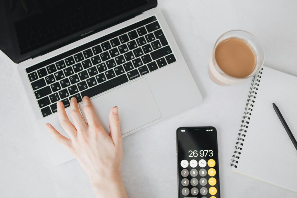 Cost calculator on desk symbolizing Pinecone vs Qdrant pricing analysis