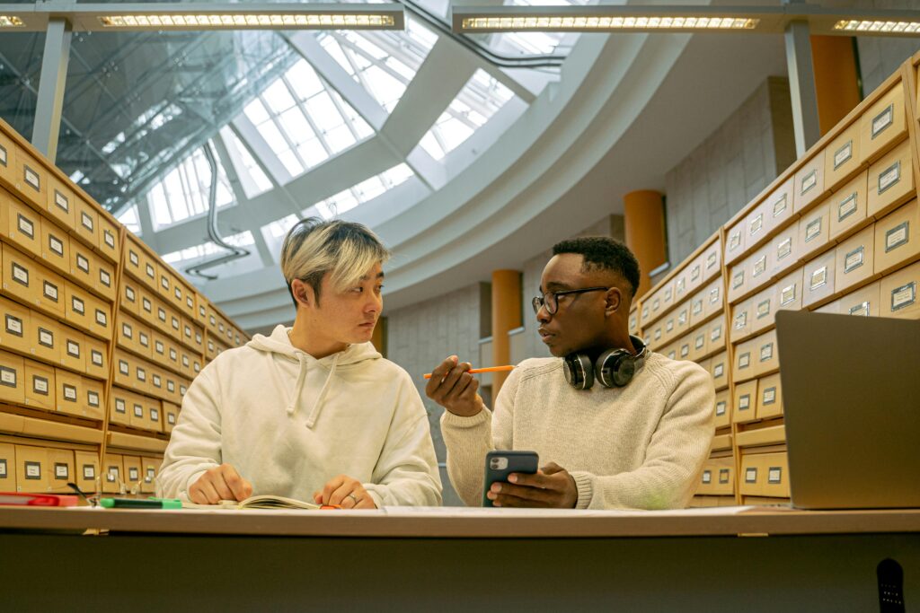 Team collaborating on laptops comparing Notion AI vs ChatGPT for the Ultimate Note System in 2025