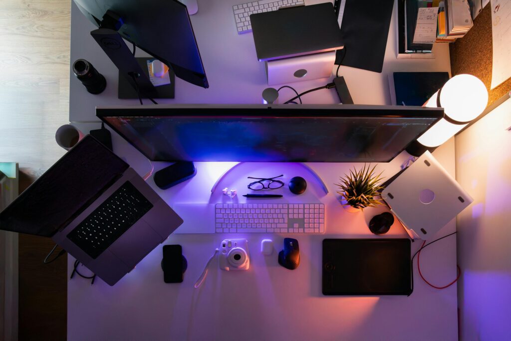 Modern creator desk setup with laptop and tablet using the Best AI Image Generators for Creators.