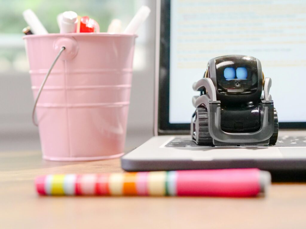 Close-up of a laptop screen where a chat assistant drafts an email—AI Assistants for Small Business in everyday use.