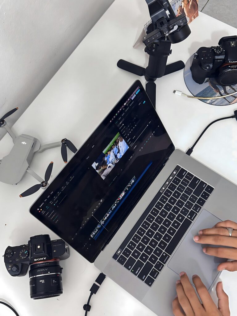 creative team editing ad video on laptop using Best AI Video Makers for Ads